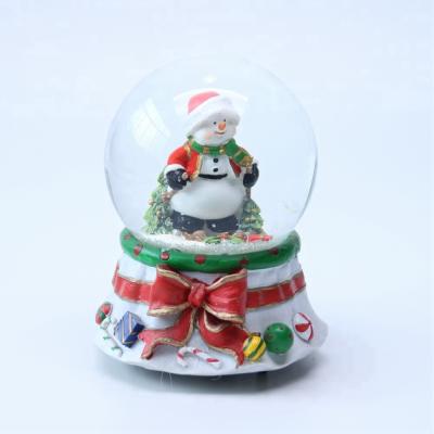 China Custom Europe Promotion Christmas Gift Musical Resin Water Snow Globe For Sale for sale