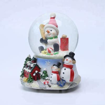 China Custom Europe OEM Christmas Glass Polyresin Snowball Snow Globe for sale