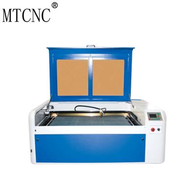 China Laser CUTTING 1040 CNC CO2 Laser Engraving Cutting Machine for sale