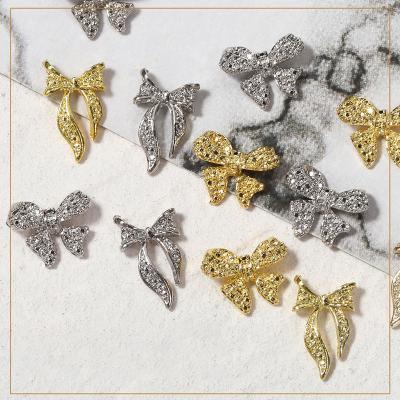 China Nail Charms Jewelry RTS Wholesale Butterfly Bowknot Crystal Bowknot Golden Silver Rhinestones Nail Decorations Hot Sale Diy Alloy Nail Design for sale