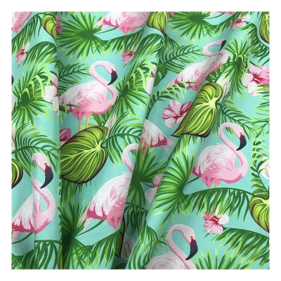 China Heat-insulation the factory outlet flamingo tropical design polyester peach digital printed 100% skin printed fabric for beach shorts wear for sale