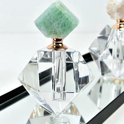 China Gift Perfume Bottles Natural Crystal Bottles With Rose Quartz Stone Lid for sale