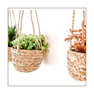 China Sustainable Outdoor Grass Woven Wall Hanging Storage Baskets Sea Plant Basket for sale