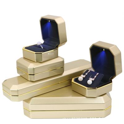 China Factory Custom Logo Velvet Wedding Ring Case Stock Led Gold Jewelry Gift Box With LED Light For Proposal Engagement Wedding for sale