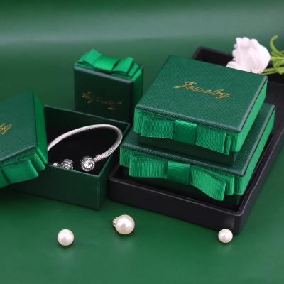 China Ruixing Square Bowknot Dark Green Jewelery Box Paper Earring Pendant Storage Box With Lid for sale