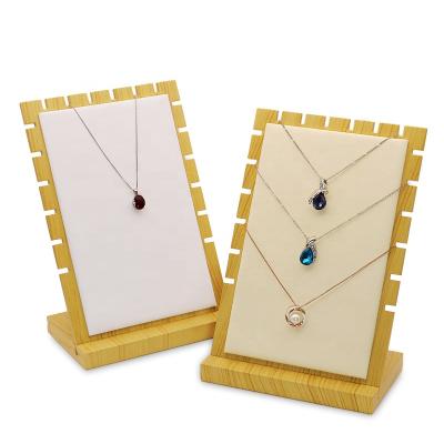 China Simple Modern Natural Bamboo Solid Wood Pendant Movable Jewelry Display Props Leather Large Capacity Necklace Display Stand for sale