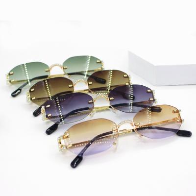 China Fashion Sunglasses Shape Cool Unique Rimless Style Rivet Sunglasses Vintage Women CIA Brand Design Sun Glasses Oculos De Sol 2022 for sale