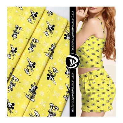 China Yibo textile 75D DTY 2 flame retardant side brushed cute cartoon print spandex fabric for dress tela DBP polyester for pajamas for sale