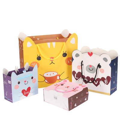 China Disposable custom cartoon paper packaging hand wedding gift rose bags logo paper printing for kids guest for sale