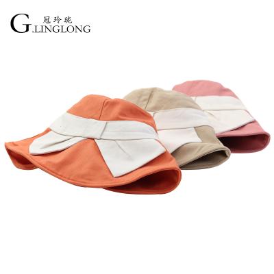 China Motome Character Large Bow Fisherman Canvas Summer Beach Hat Female Hot Sun Hat Factory Outlet for sale