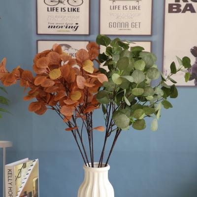 China Silk Artificial Plant Green Plastic Tree Branches Wedding Decoration Hotel Eucalyptus Leaves Green Fabric for sale