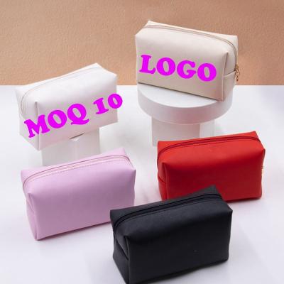 China Durable Wholesale Light Pink Logo PVC Makeup Bags Transparent Cosmetic Bags for sale