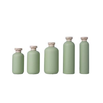 China Classic Green Herb HDPE 200ml 250ml 300ml 400ml 500ml Body Lotion Shampoo Cosmetics Bottles With Flip Caps for sale