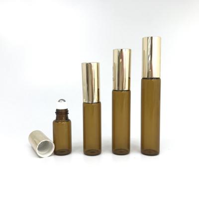 China Personal Care 5ml 8ml 10ml 12ml Personal Care Amber Glass Empty Slim Roller Bottle With Gold Cap for sale