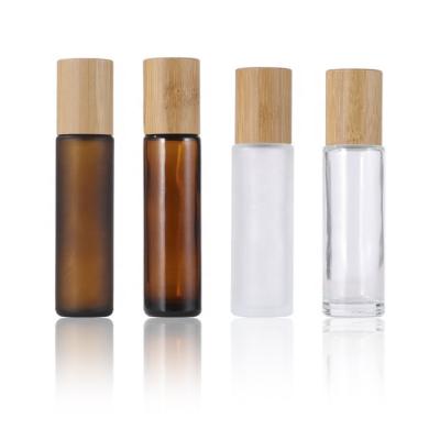 China Classic 15ml Clear Frosted Amber Matte Piping Roll Glass Bottles With Stainless And Bamboo Lid for sale