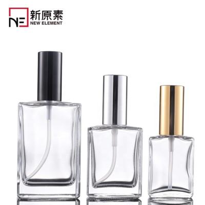 China Square 15ml 30ml 50ml 100ml Wholesale Classic Flat Perfume Spray Glass Perfume Bottles With Silver Gold Black Cpas for sale