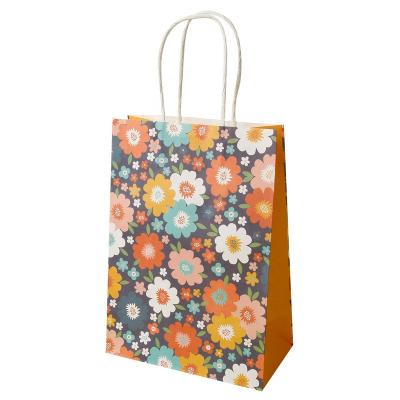 China Biodegradable Customized Twisted Handle Paper Treat Bags Kraft Flower Boutique Paper Bag for sale