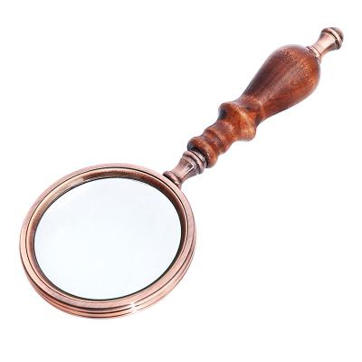 China 10 Times Zinc Alloy Wooden Handle Reading Magnifier Optical Glass Magnifier for sale