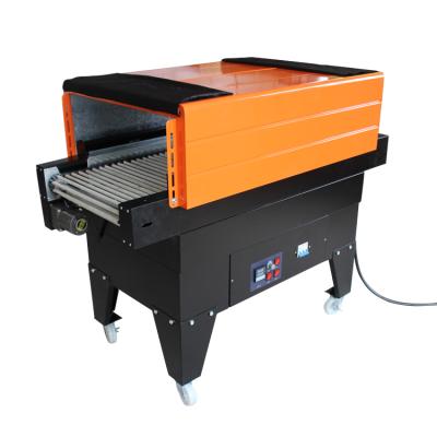 China Hot Selling Safety Plastic Wrap Packing Machine Shrinkable Film Shrinking Machine for sale