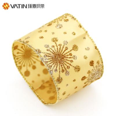 China 63mm Lasting Glitter Fireworks Pattern Gold Foil Stamping Sprinkles Christmas Wired Satin Edged Diamond Ribbon for sale