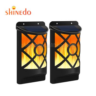 China Garden Design for Yard Garden Wall Mounted Flame Dacing Solar Wall Light for sale