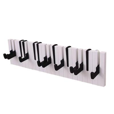 China Storage Minimalist Creative Hot Sale Piano Theme Hanger Wooden Wall Hook And Hanger for sale