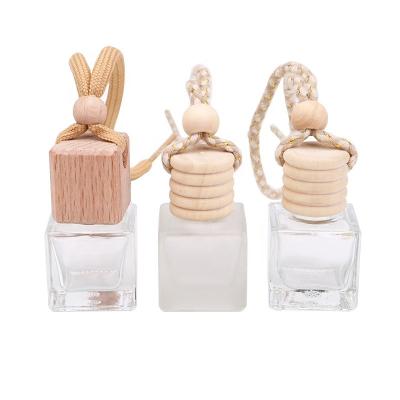 China Gift Wholesale 10ml Empty Diffuser Duct Air Hanging Cap Wooden Car Perfume Diffuser Bottle for sale