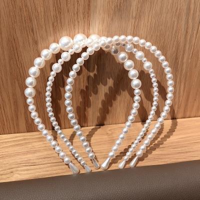 China 2022 New Custom Fashion Women's Korean Simple Hair Accessories Headband Braided Pearl Hair Band For Women for sale