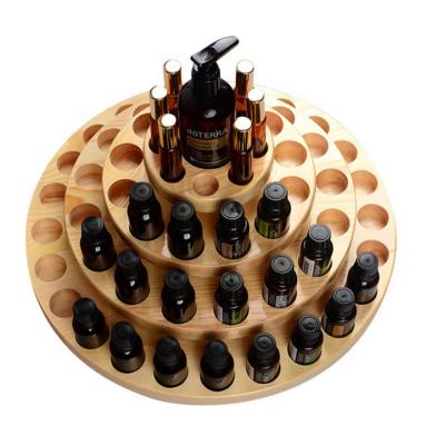 China Recyclable Varnished Essential Oil Display Use Custom Round Wooden Essential Oil Rack for sale