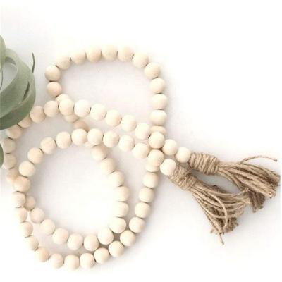 China Eco-friendly Home Wooden Antique Country Farmhouse Beads Decoration Wall Beads Tassel Wooden Beads for sale