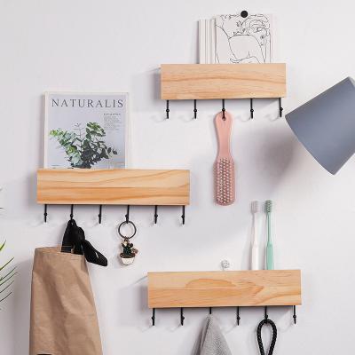 China Wholesale Home Decoration Living Room Storage Wooden Wall Shelf With Hanger for sale