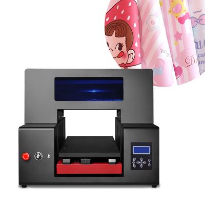 China Mini Uv Printer Factory Top Sale DTF UV Printer 6090 Can Stick On Wooden Phone Case Metal Bottle With Varnish Function Dtf UV Printer for sale