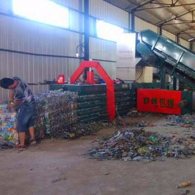 China Qunfeng Hydraulic Wood Baler Compactor Baler Waste Paper Compactor Machine for sale