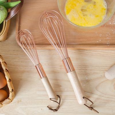 China Sustainable durabld kitchen instruments luxury tools rose wooden egg beater golden handle household automatic eggbeater for sale