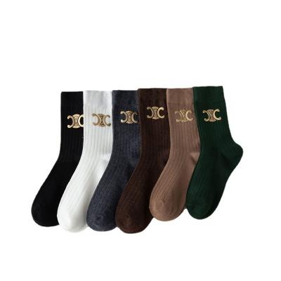 China Sustainable Fashion Trending Socks Solid Color Girl Long Socks Winter Cotton Letter Socks For Women for sale