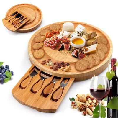 China Sustainable Round Bamboo Cheese Board Set With Remove Drawer And Knife Sets for sale