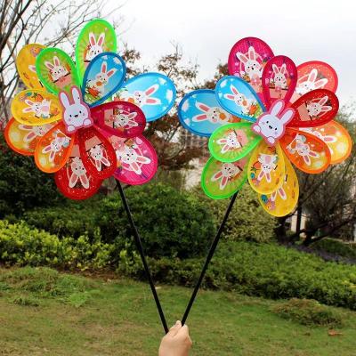 China Outdoor Toy Hot cartoon pattern plastic double windmill wholesale children's toys colourful windmill outdoor garden decoration for sale