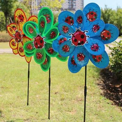 China Outdoor Toy New outdoor decorations children's toys double large peacock sequins insects colourful plastic windmill wholesale for sale