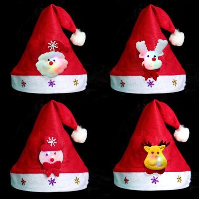 China Nonwoven New Led Light Christmas Decorations Adult And Children Santa Hats Cartoon Snowman Elk Santa Hats for sale