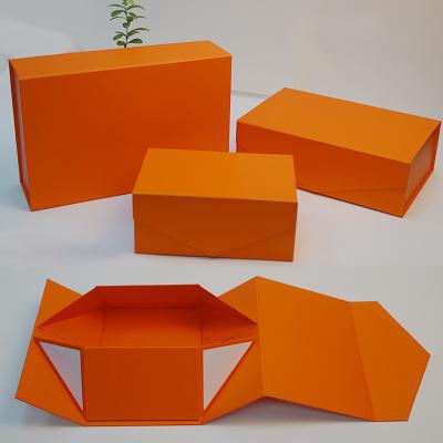 China Recyclable Custom Luxury Paper Magnet Book Jacket Gift Box Foldable Folding Magnetic Clothing Clothing Packaging Box for sale