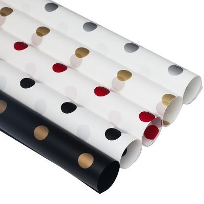 China Dot Waterproof Wholesale Design Cheap Waterproof Wrapping Paper For Flower Wrapping for sale