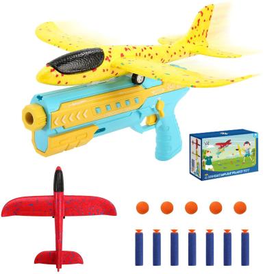 China Electronic Toy O WOWZON 4 in 1 One-Click Ejection Model Safer EVA Foam Airplane Launcher Toys Game Shooting Toy for sale