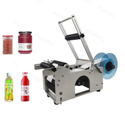 China MAKWELL Food Wine Double Side Sticker Round Water Digital Manual Bottle Labeling Machine For Plastic Bottle for sale