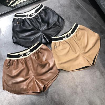 China 2022 High Waist Letter Design High Fashion Anti-wrinkle Ribbon Triangle Ribbon Drawstring Women Black PU Leather Shorts for sale