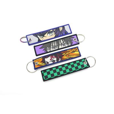 China Promotioanal Gifts/Wholesale Cartoon Kawaii Logo Woven Animation Keychain Custom Giveaway With Rainbow Key Ring for sale