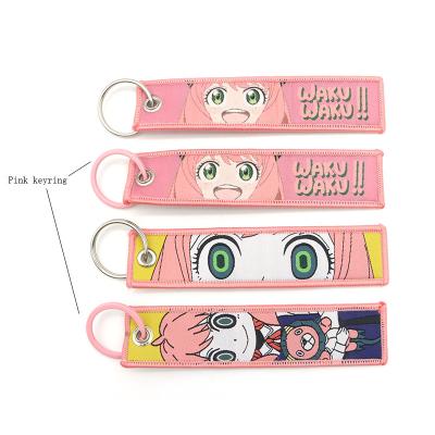 China Promotioanal Gifts / Give Away Customize Cheap Kawaii Cute Logo Embroidered Anime Personalized Motorcycle Woven Keychain for sale