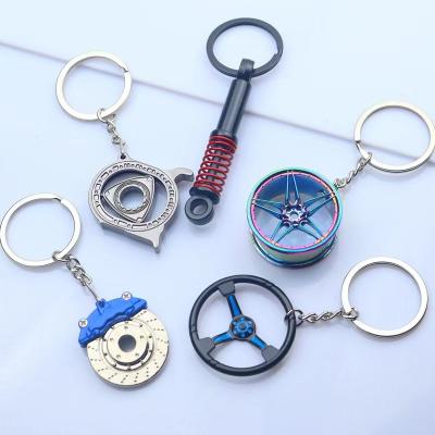 China Promotional Metal Gifts Car Accessories Tires Brakes Interior Laserable Logo Modification Mini Keychain for sale