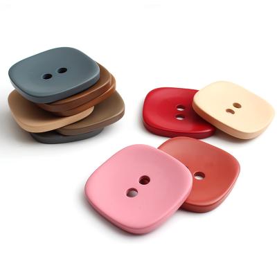 China Exquisite Dry Cleaning Art Square Two Hole Resin Button Painting Spray Clothing Accessories Sewing Buttons for sale