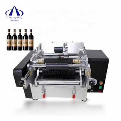 China Simple Operation Hand Tin Can Label Sticker Printing Nylon Wet Glue Paste Labeling Machine Price for sale