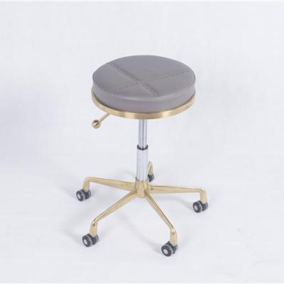 China New Design Gold Beauty Salon Master Stool Durable Material Comfortable Vintage Barber Chair for sale